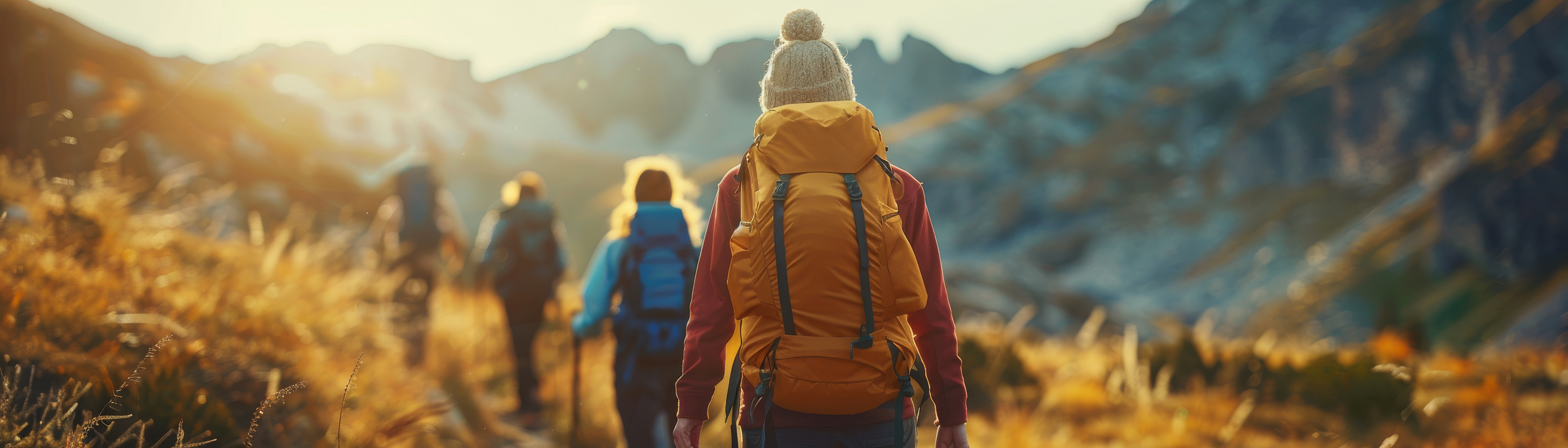 Guide leading a small group outdoors at golden hour